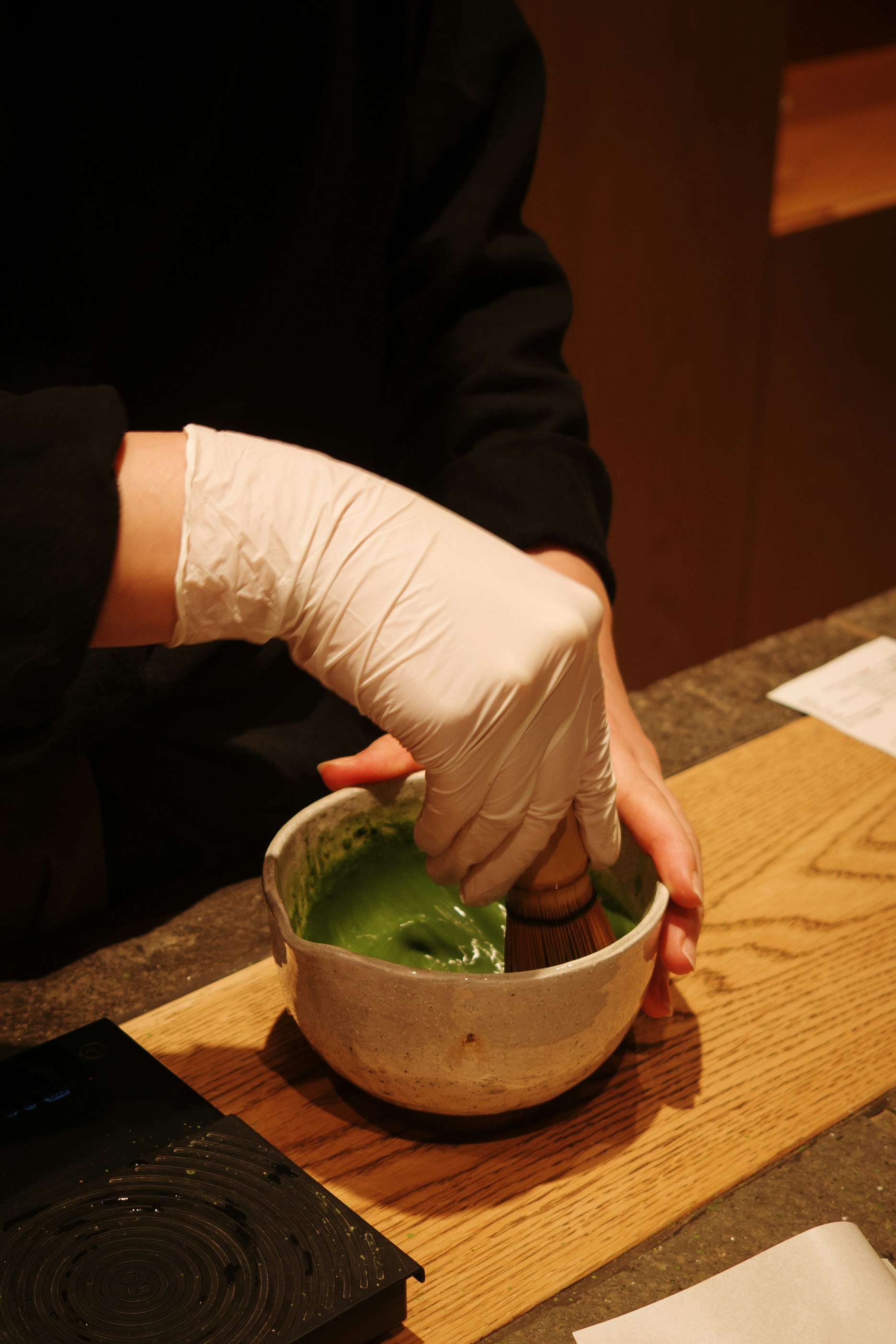 Matcha tea being prepared in a traditional bowl